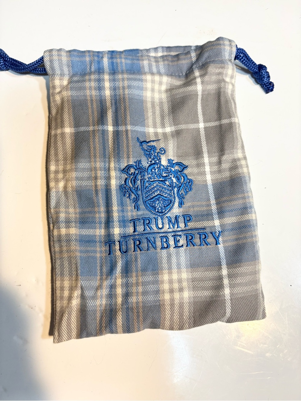 Trump Turnberry tartan drawstring bag blue embroidered crest blue rope ties.